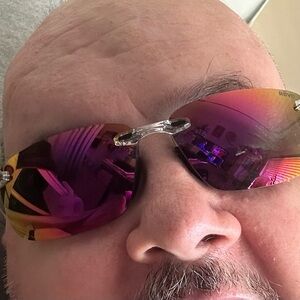 Revo Sunglasses with orange lenses and clear frames, one with blue lenses/blk fr